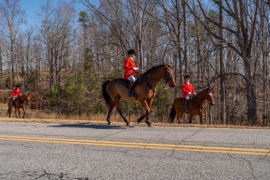 Riders moving off along the road
